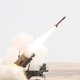 A Patriot missile is launched by soldiers from C-Battery, 3rd Battalion (Airborne), 4th Air Defense Field Artillery Regiment, 108th Air Defense Artillery Brigade, at an airborne target during a joint live-fire exercise held Oct. 1, 2014.